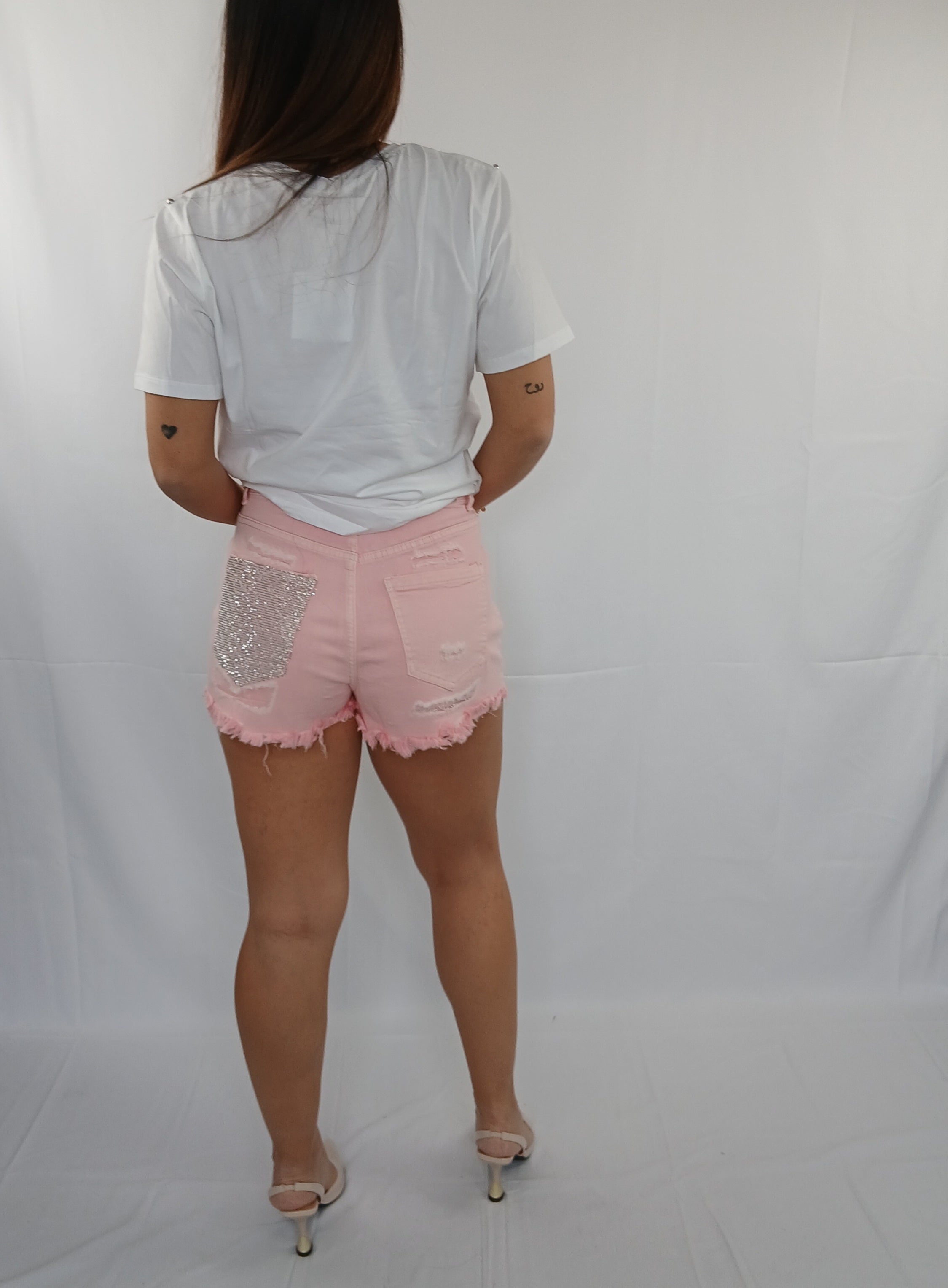 T-Shirt bianca con tasca rosa e brillantini