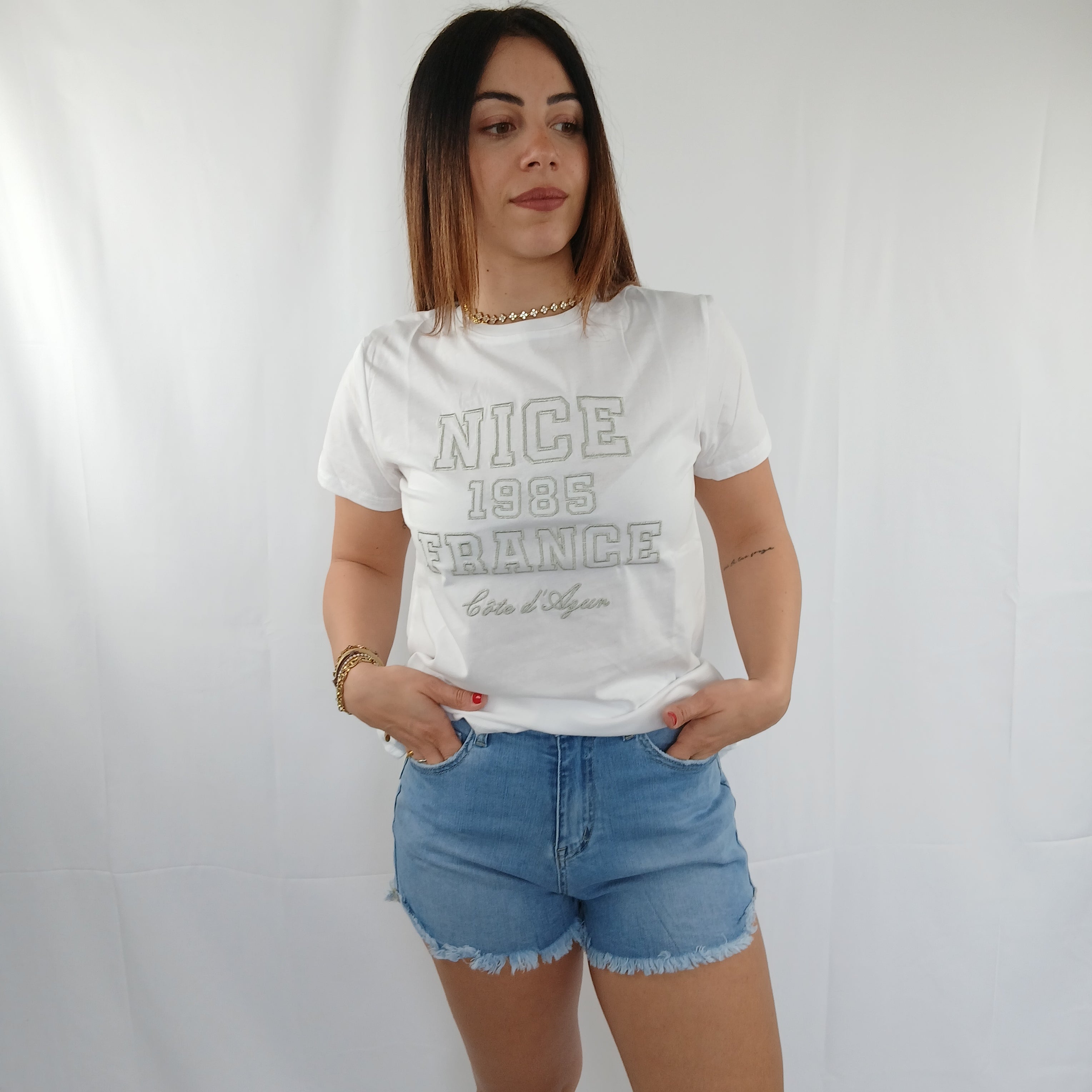 Pantaloncino jeans con tasca leopardata e brillantini