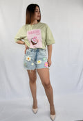 Jeans con fiori cuciti
