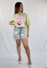 Jeans con fiori cuciti