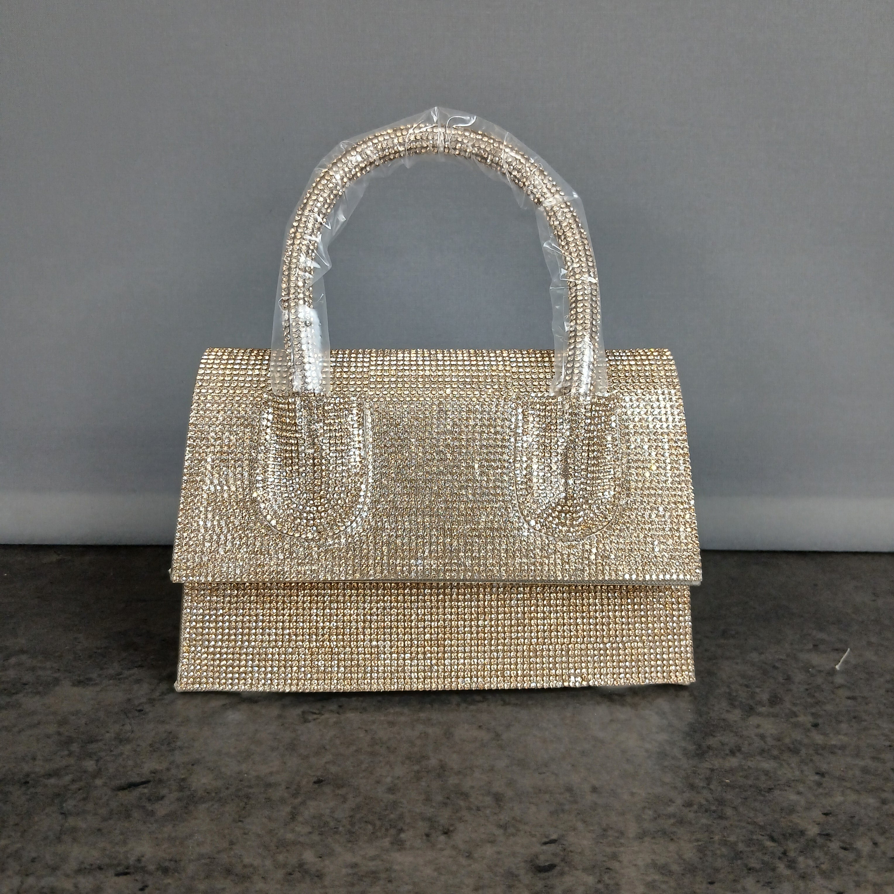 Borsa a mano glitterata con manico rigido