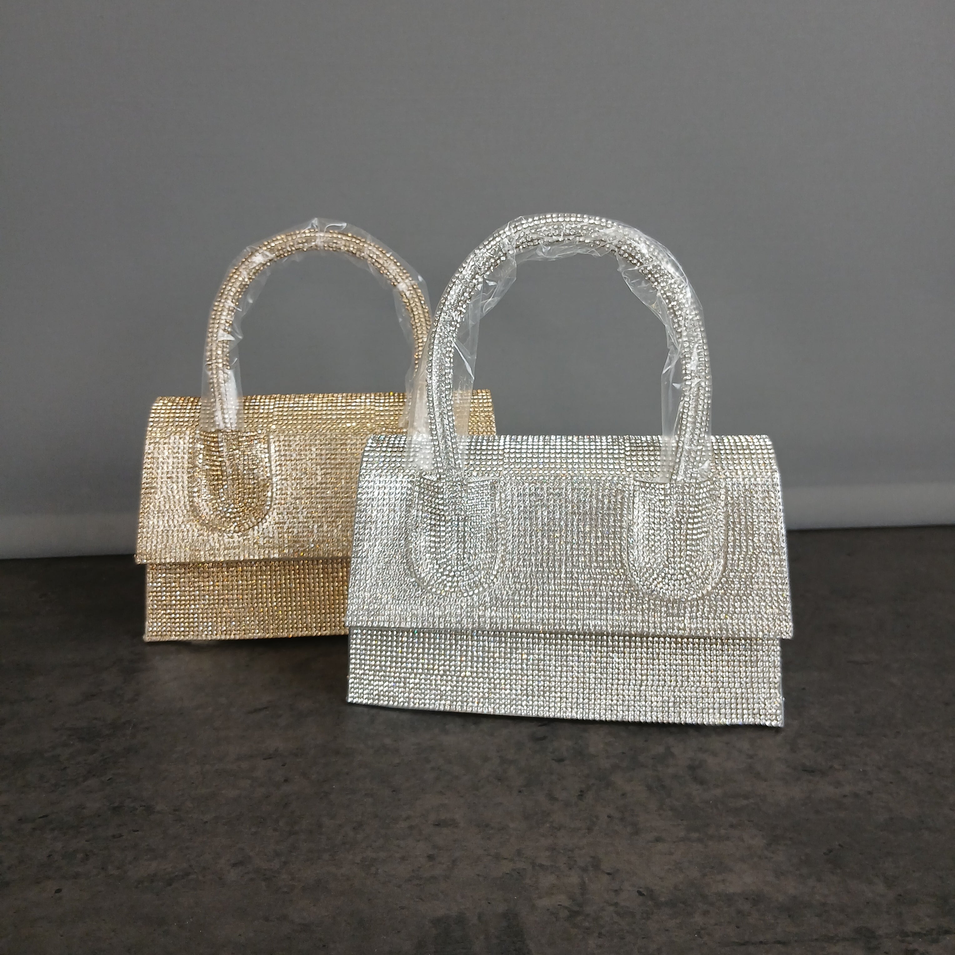 Borsa a mano glitterata con manico rigido