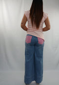Pantalone jeans palazzo con tasche rosa e brillantini