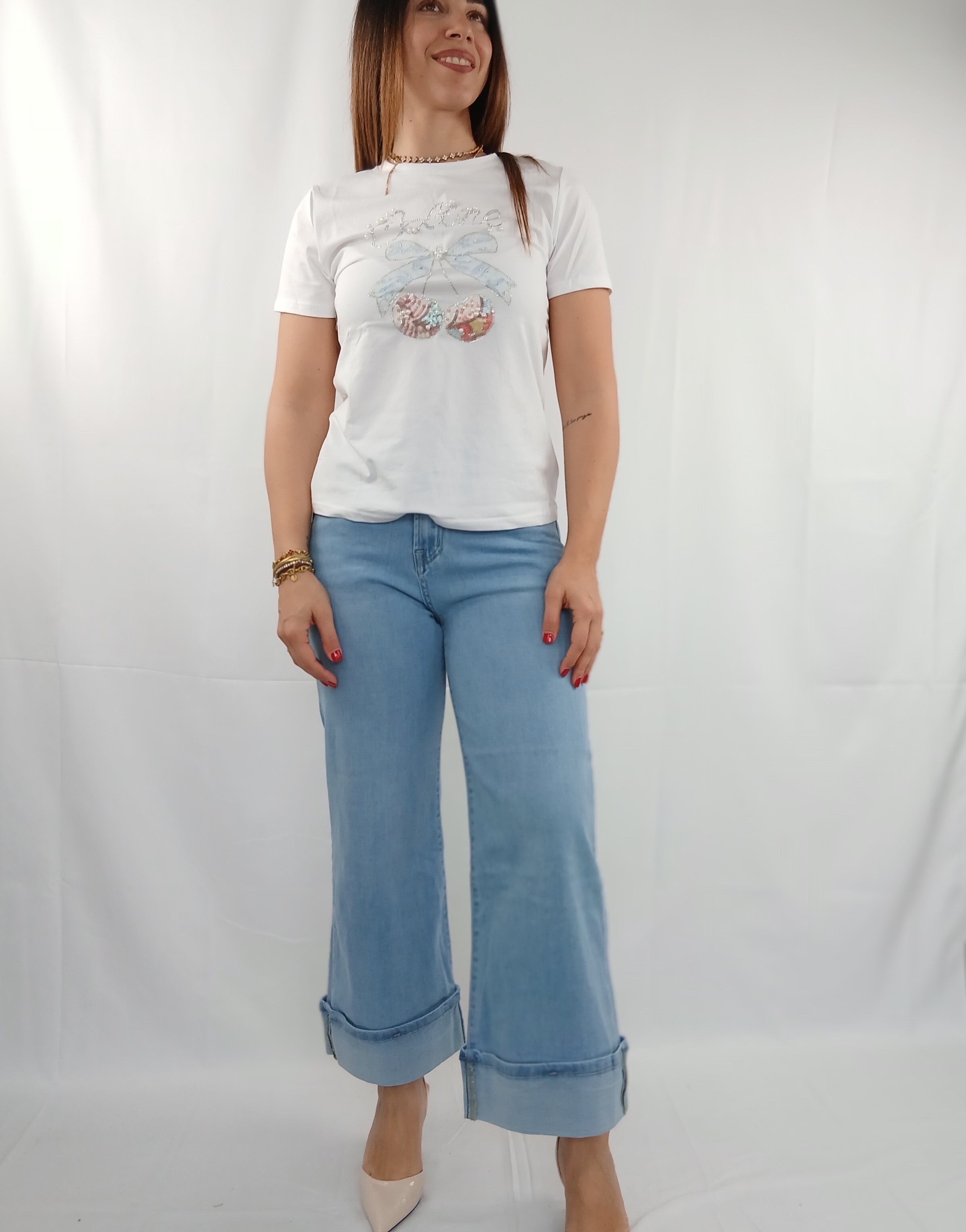 Pantalone jeans con piega e tasca brillantini