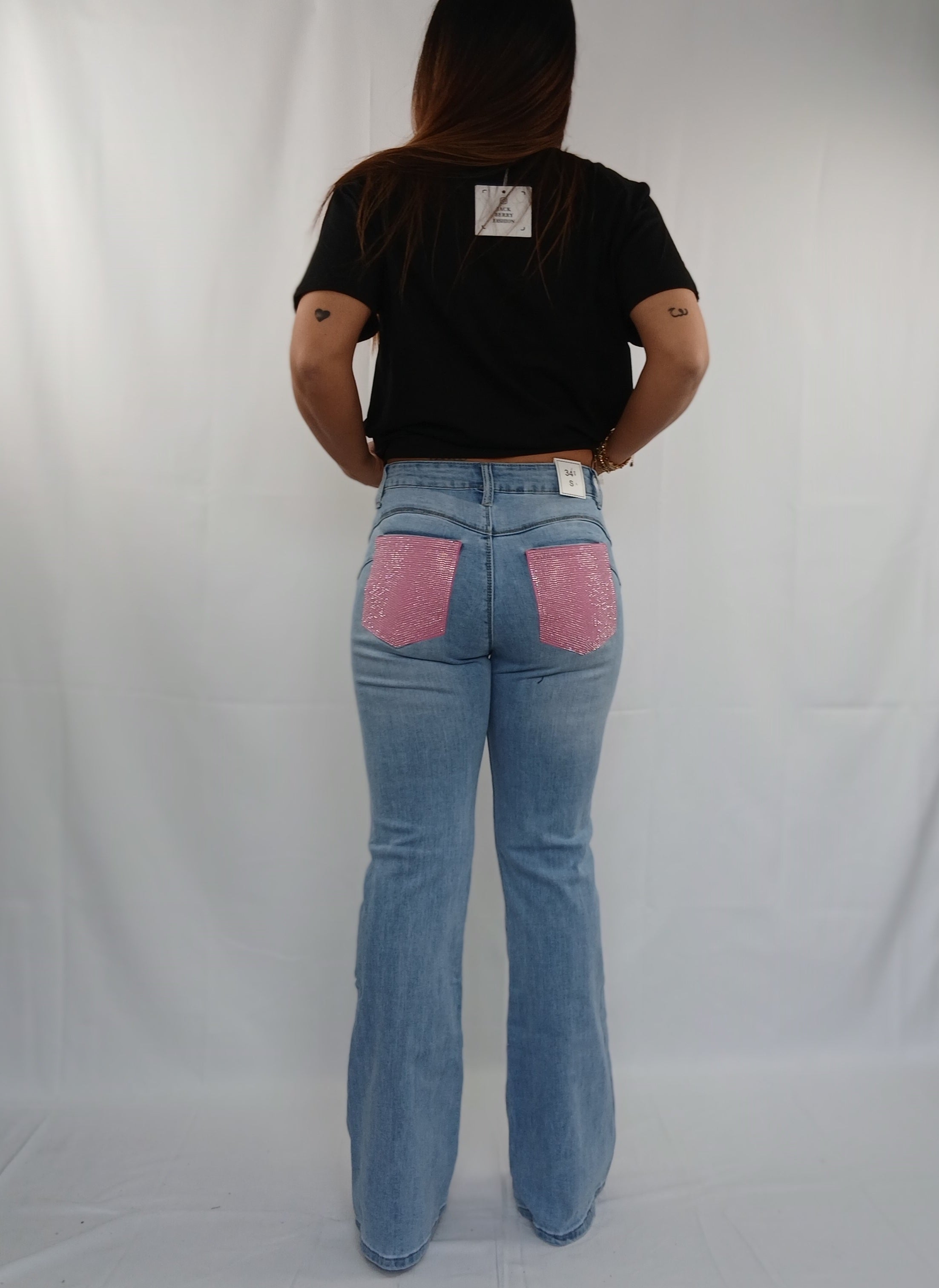 Pantalone jeans zampa con tasche rosa e brillantini